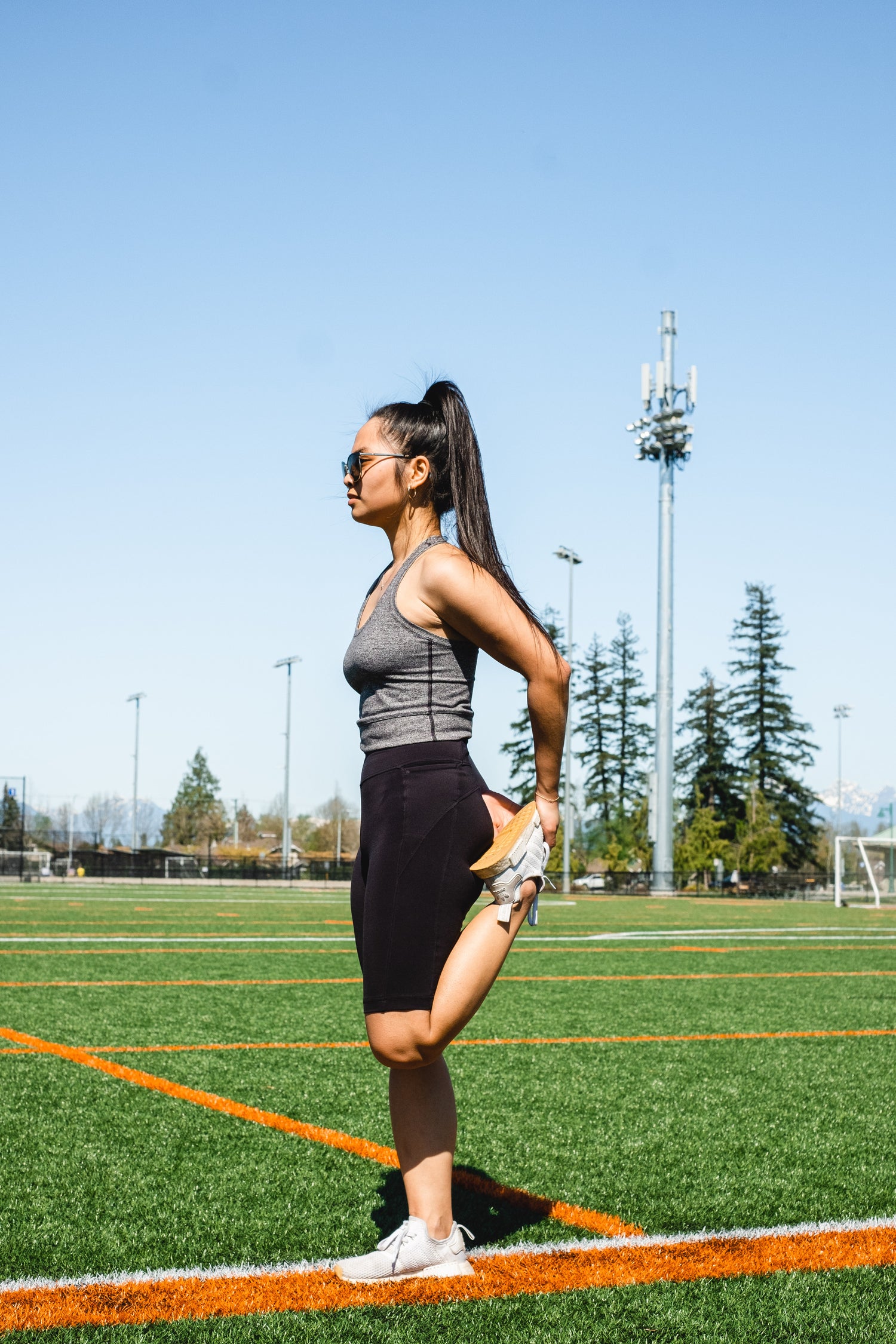 Woman stretching her leg while standing